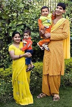 Svetlana Singh holds her huge son (right). To the left, a friend holds her normal-size baby of the same age